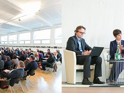 Foto des Publikums und des Podiums u. a. mit Karl Wilbers und Jürgen Horschinegg